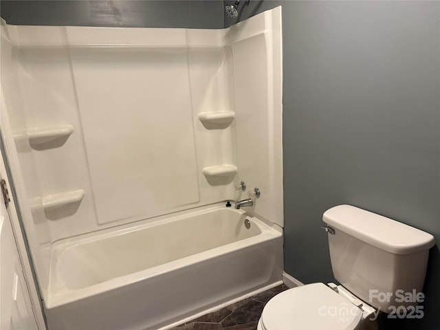 303 Southern Ave, East Spencer, NC 28039 - bathroom with toilet, tub / shower combination, and baseboards