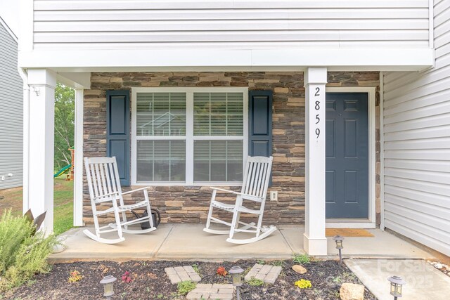 2859 Sherrills Stream Dr, Sherrills Ford, NC 28673 - view of exterior entry featuring stone siding and covered porch