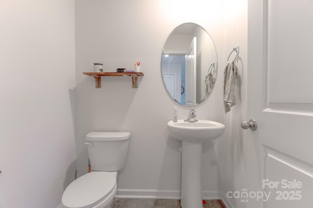 2859 Sherrills Stream Dr, Sherrills Ford, NC 28673 - half bath featuring toilet, a sink, and baseboards