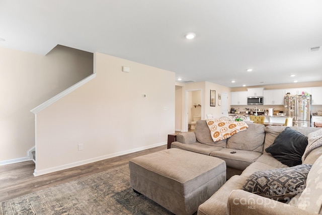 2859 Sherrills Stream Dr, Sherrills Ford, NC 28673 - living area featuring wood finished floors, stairs, baseboards, and recessed lighting