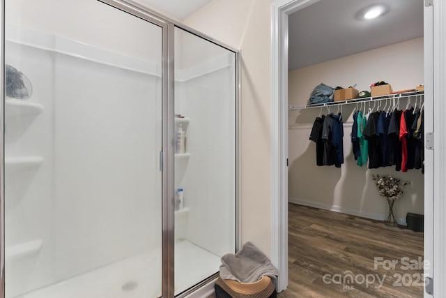 2859 Sherrills Stream Dr, Sherrills Ford, NC 28673 - full bath featuring a stall shower, wood finished floors, and a walk in closet