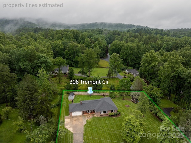 306 Tremont Park Cir SE, Lenoir, NC 28645 - view of subject property with property boundaries highlighted and a heavily wooded area