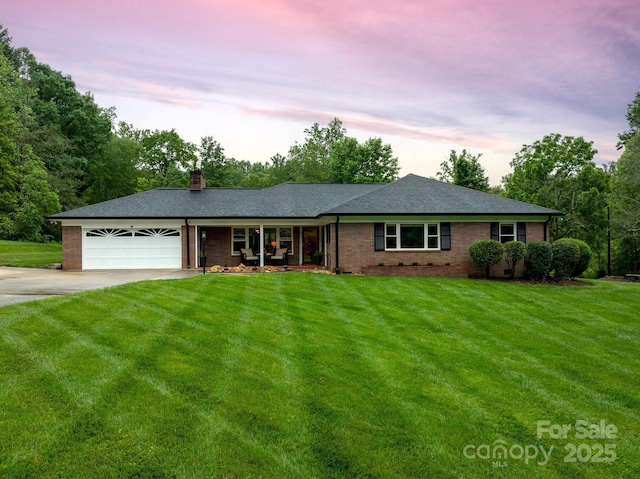 306 Tremont Park Cir SE, Lenoir, NC 28645 - ranch-style home featuring concrete driveway, an attached garage, a front lawn, and a chimney