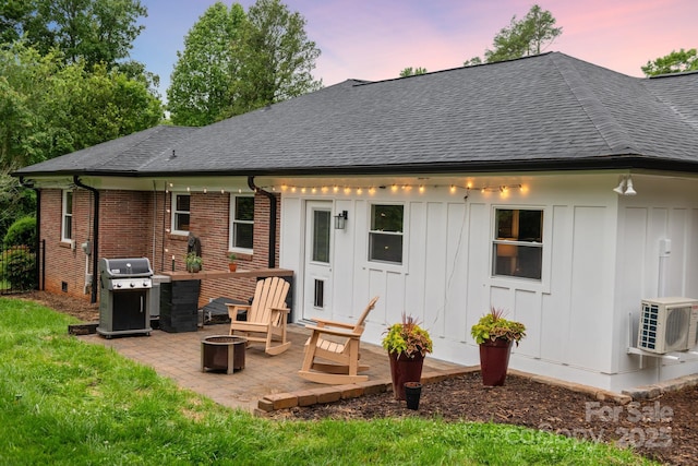 306 Tremont Park Cir SE, Lenoir, NC 28645 - back of property with an outdoor fire pit, roof with shingles, ac unit, and a patio area