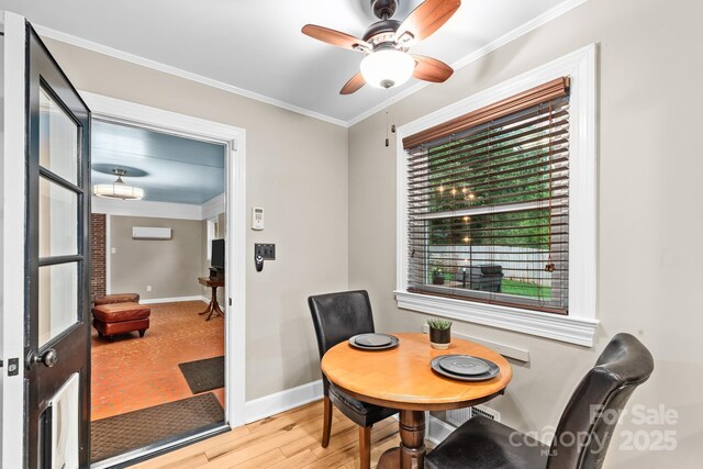 306 Tremont Park Cir SE, Lenoir, NC 28645 - dining space with baseboards, crown molding, wood finished floors, and ceiling fan