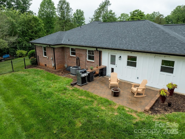 306 Tremont Park Cir SE, Lenoir, NC 28645 - rear view of property featuring roof with shingles, an outdoor fire pit, a patio area, and board and batten siding