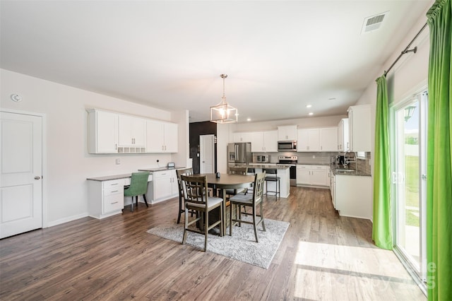 711 Saddlebred Ln, Locust, NC 28097 - dining space featuring wood finished floors, recessed lighting, and baseboards
