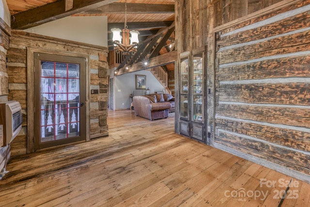 164 Avery County High School Rd, Newland, NC 28657 - entryway featuring a chandelier, wood-type flooring, high vaulted ceiling, heating unit, and wooden ceiling with exposed beams