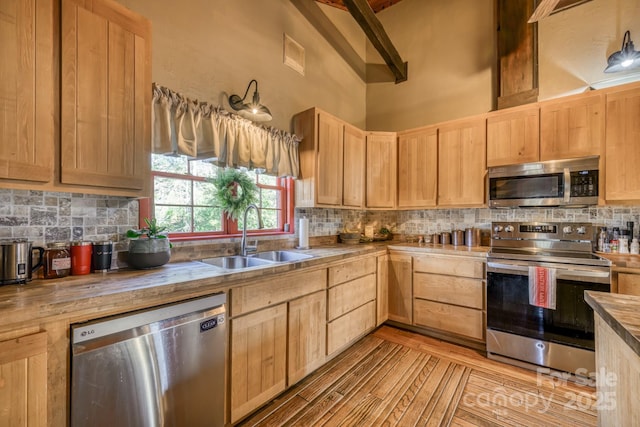 164 Avery County High School Rd, Newland, NC 28657 - kitchen featuring appliances with stainless steel finishes, a sink, and light brown cabinets