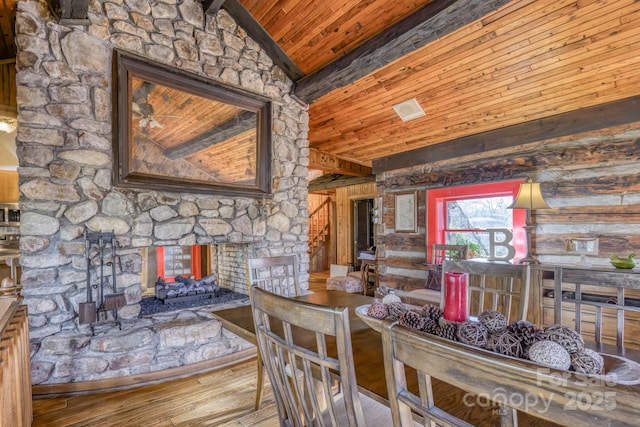 164 Avery County High School Rd, Newland, NC 28657 - dining area with vaulted ceiling, wood ceiling, hardwood / wood-style floors, and a stone fireplace