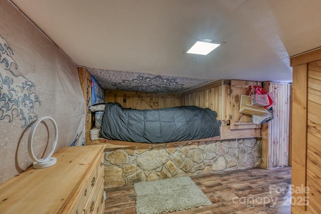 164 Avery County High School Rd, Newland, NC 28657 - bedroom with wood finished floors and wooden walls
