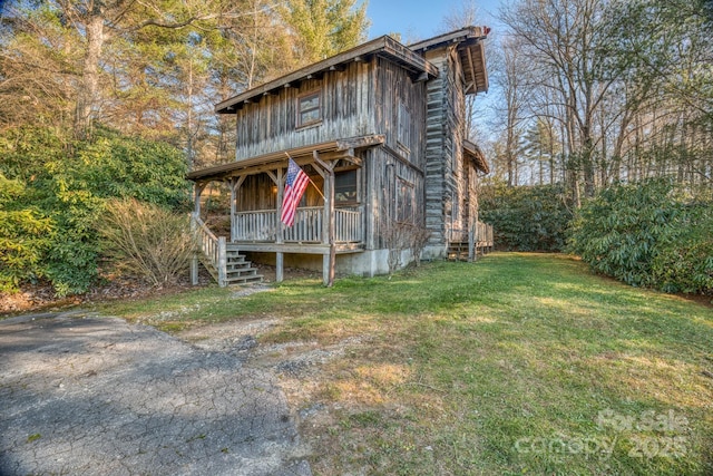 164 Avery County High School Rd, Newland, NC 28657 - view of front of property with a porch and a front yard
