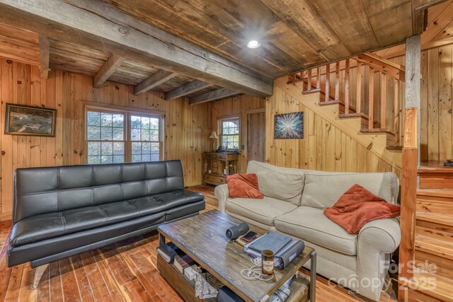 164 Avery County High School Rd, Newland, NC 28657 - living area featuring wood ceiling with exposed beams, wood walls, stairway, and hardwood / wood-style flooring