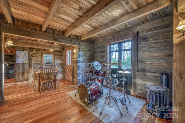164 Avery County High School Rd, Newland, NC 28657 - dining room featuring wooden ceiling with exposed beams, wood walls, and hardwood / wood-style flooring