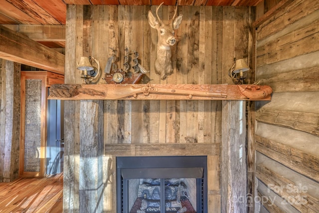 164 Avery County High School Rd, Newland, NC 28657 - detailed view of a fireplace, wood finished floors, wood walls, and wooden ceiling