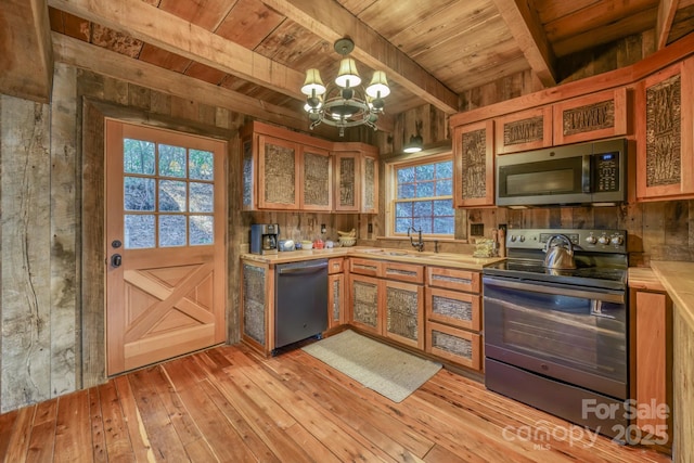 164 Avery County High School Rd, Newland, NC 28657 - kitchen with appliances with stainless steel finishes, wooden ceiling with exposed beams, light countertops, a chandelier, and light wood-type flooring