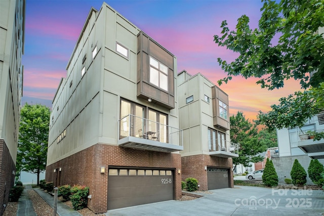 925 Westbrook Dr Unit B, Charlotte, NC 28202 - view of property featuring an attached garage and concrete driveway