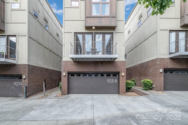 925 Westbrook Dr Unit B, Charlotte, NC 28202 - view of property featuring a garage and concrete driveway