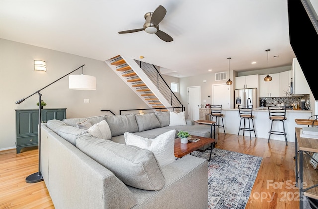 925 Westbrook Dr Unit B, Charlotte, NC 28202 - living room with ceiling fan, light wood-style floors, stairway, and recessed lighting
