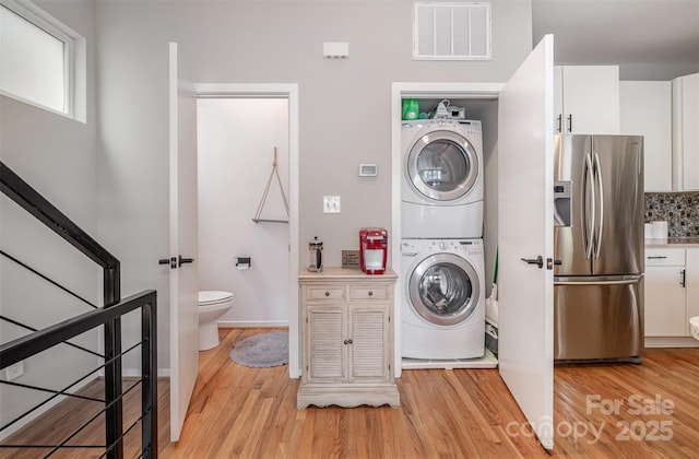 925 Westbrook Dr Unit B, Charlotte, NC 28202 - washroom with stacked washer / drying machine and light wood-type flooring