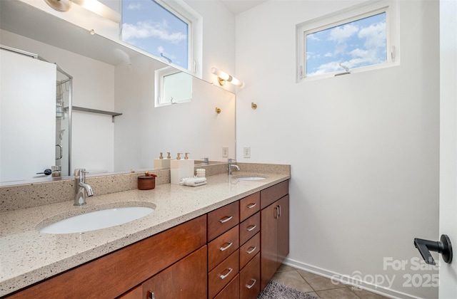 925 Westbrook Dr Unit B, Charlotte, NC 28202 - full bath with tile patterned flooring, double vanity, and healthy amount of natural light