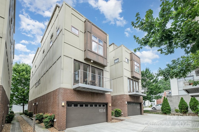 925 Westbrook Dr Unit B, Charlotte, NC 28202 - view of building exterior with a garage and concrete driveway
