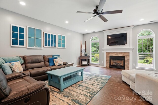 147 Whitley Mills Rd, Fort Mill, SC 29708 - living area featuring healthy amount of natural light, a ceiling fan, wood finished floors, a glass covered fireplace, and recessed lighting