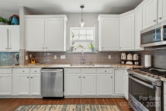 147 Whitley Mills Rd, Fort Mill, SC 29708 - kitchen featuring appliances with stainless steel finishes, a sink, white cabinets, dark wood finished floors, and decorative backsplash