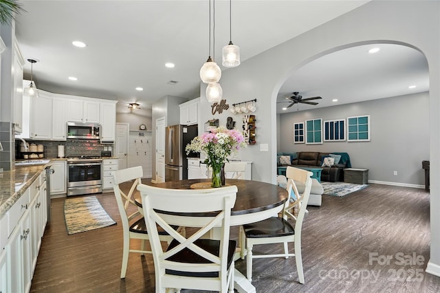 147 Whitley Mills Rd, Fort Mill, SC 29708 - dining room featuring arched walkways, a ceiling fan, dark wood-style floors, recessed lighting, and baseboards