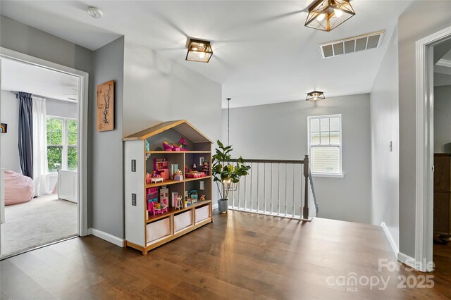 147 Whitley Mills Rd, Fort Mill, SC 29708 - hallway with an upstairs landing, wood finished floors, and baseboards