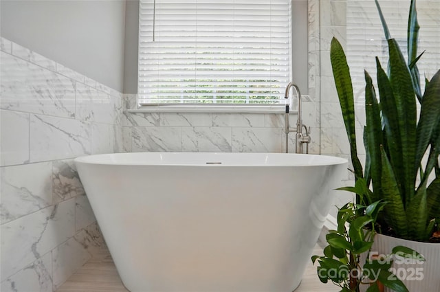 147 Whitley Mills Rd, Fort Mill, SC 29708 - bathroom with tile walls and a freestanding tub