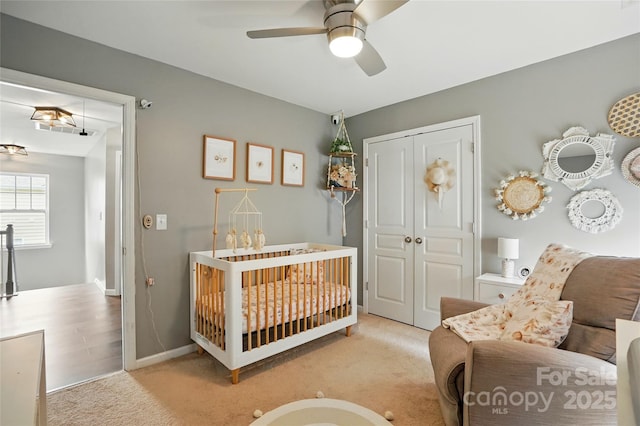 147 Whitley Mills Rd, Fort Mill, SC 29708 - carpeted bedroom with a closet, a ceiling fan, and a crib