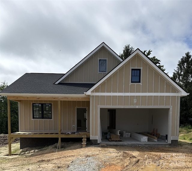 30 Olde Oak Ct, Hendersonville, NC 28792 - rear view of property featuring board and batten siding, roof with shingles, and a garage