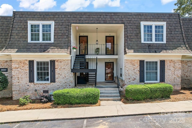 3520 Colony Rd Unit D, Charlotte, NC 28211 - view of front of property with mansard roof, brick siding, and a balcony