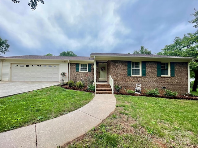311 Tiffany St NW, Concord, NC 28027 - ranch-style house with a garage, brick siding, driveway, and a front lawn
