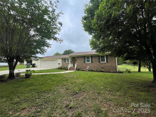 311 Tiffany St NW, Concord, NC 28027 - ranch-style house featuring crawl space, an attached garage, brick siding, and concrete driveway