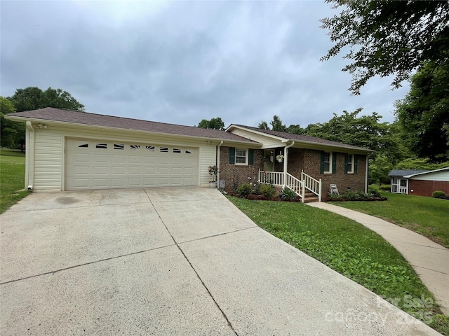 311 Tiffany St NW, Concord, NC 28027 - ranch-style house with driveway, a garage, a front lawn, and brick siding