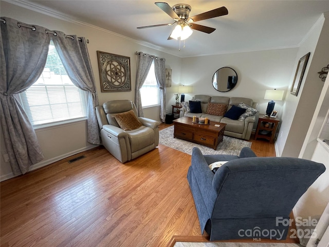311 Tiffany St NW, Concord, NC 28027 - living area featuring a ceiling fan, crown molding, light wood-style flooring, and baseboards