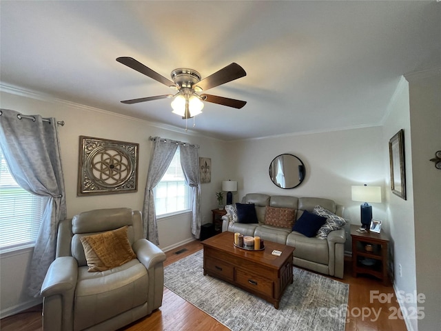 311 Tiffany St NW, Concord, NC 28027 - living area with crown molding, a ceiling fan, wood finished floors, and baseboards