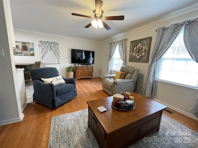311 Tiffany St NW, Concord, NC 28027 - living room with ceiling fan, crown molding, light wood-style flooring, and baseboards