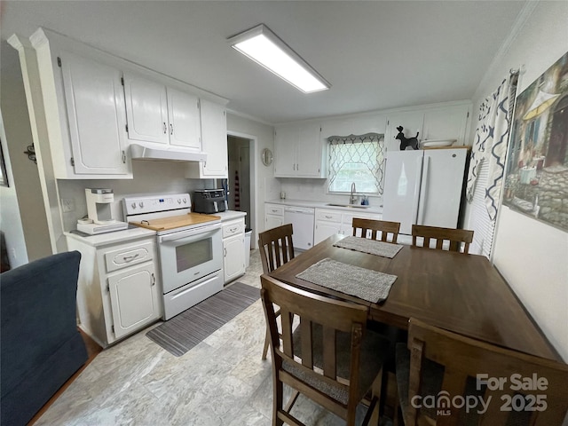 311 Tiffany St NW, Concord, NC 28027 - kitchen featuring white appliances, a sink, under cabinet range hood, white cabinets, and light countertops