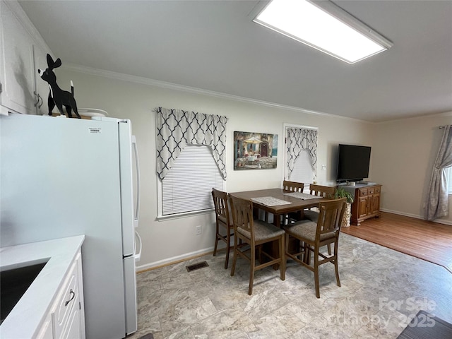311 Tiffany St NW, Concord, NC 28027 - dining space featuring ornamental molding and baseboards