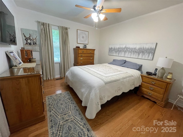 311 Tiffany St NW, Concord, NC 28027 - bedroom featuring light wood-style flooring, ornamental molding, and a ceiling fan