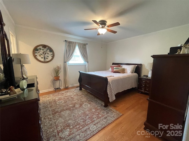 311 Tiffany St NW, Concord, NC 28027 - bedroom featuring crown molding, wood finished floors, and a ceiling fan