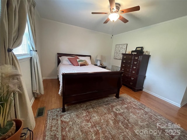 311 Tiffany St NW, Concord, NC 28027 - bedroom featuring wood finished floors, baseboards, crown molding, and ceiling fan
