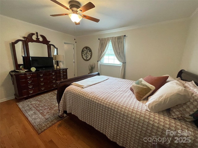 311 Tiffany St NW, Concord, NC 28027 - bedroom with wood finished floors, crown molding, and ceiling fan