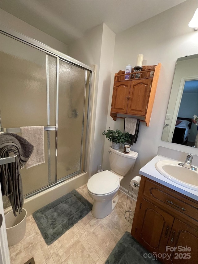 311 Tiffany St NW, Concord, NC 28027 - bathroom with toilet, vanity, and a stall shower