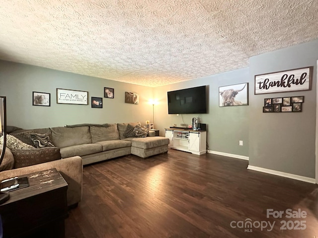 3503 Wyndham Ln, Lenoir, NC 28645 - living room featuring dark wood-type flooring, a textured ceiling, and baseboards