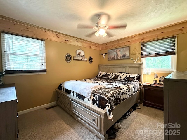 3503 Wyndham Ln, Lenoir, NC 28645 - bedroom with light colored carpet, ceiling fan, and baseboards