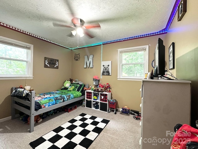 3503 Wyndham Ln, Lenoir, NC 28645 - bedroom with a textured ceiling, carpet flooring, and a ceiling fan